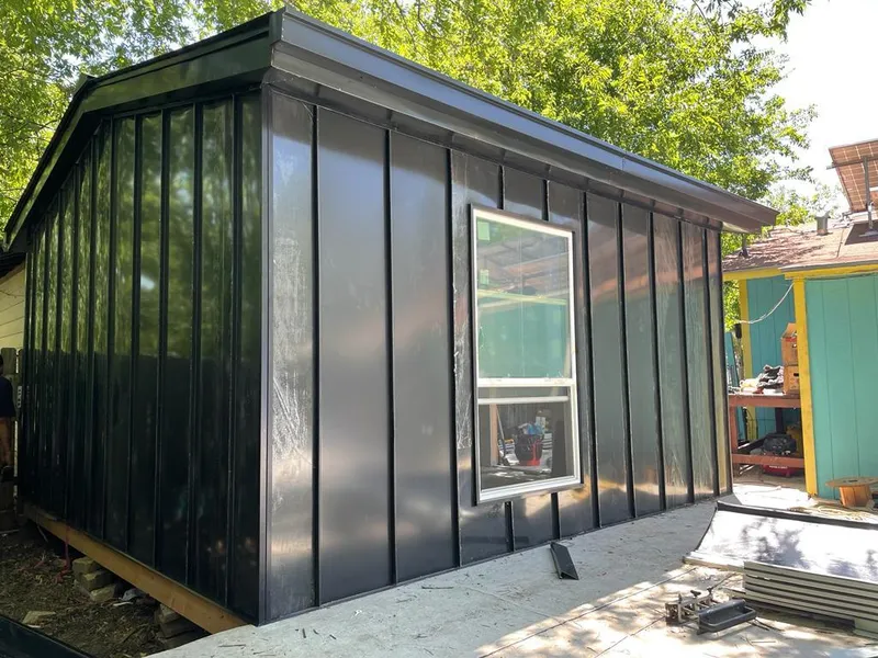 Black standing seam metal wall panels for Roof Inspection in North Andover