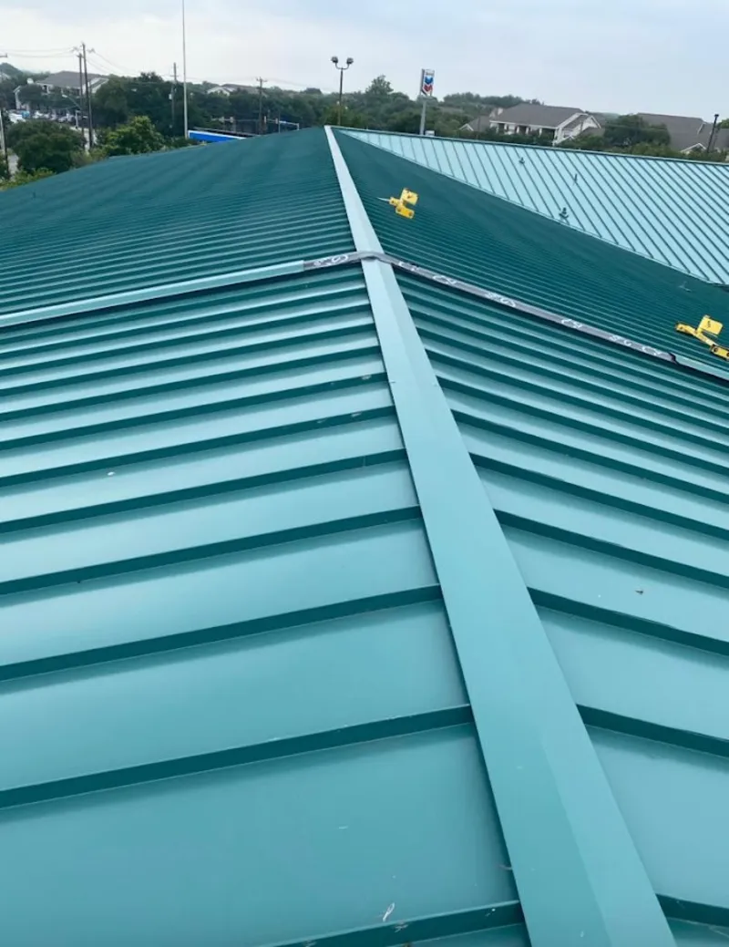 Green commercial metal roof ridge and valley for Metal Roof Repair in North Andover