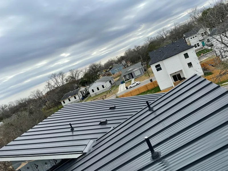 Standing seam metal roof panels with vents for Skylight Repair in North Andover
